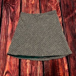 Old Navy size 6 black and white skirt with green skirt underneath